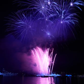 Blue colorful fireworks on the black sky background