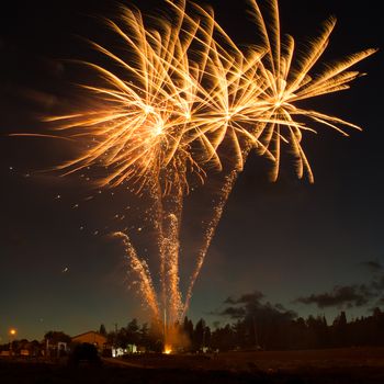 Red colorful fireworks on blue sky background