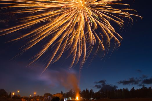 Red colorful fireworks on blue sky background