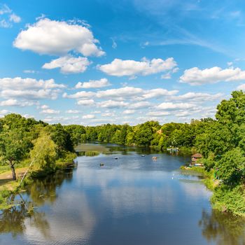 Forest on the river with blue sky and landscape of clouds