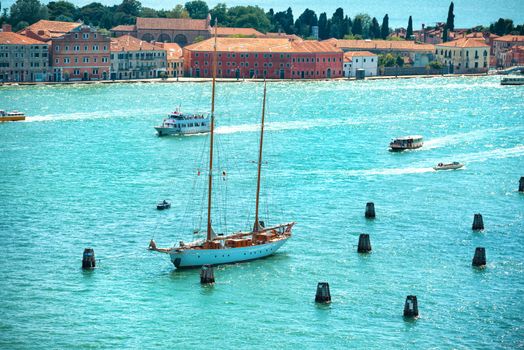 View from Campanile bell tower on yacht in Grand Canal. Sunny day in Venice, Italy.