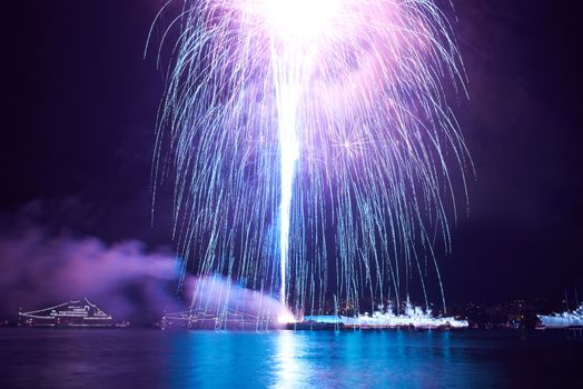 Blue colorful fireworks on the black sky background