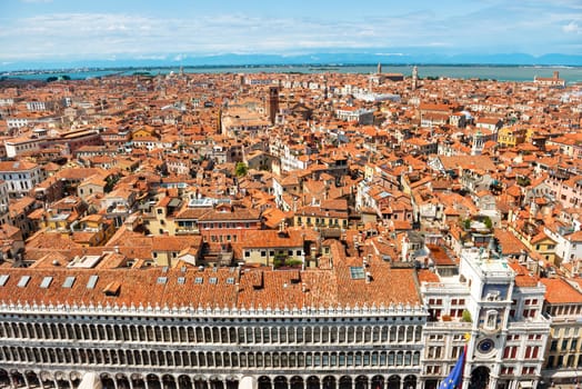 Venice roofs from above. Aerial view of houses, sea and palaces from San Marco tower