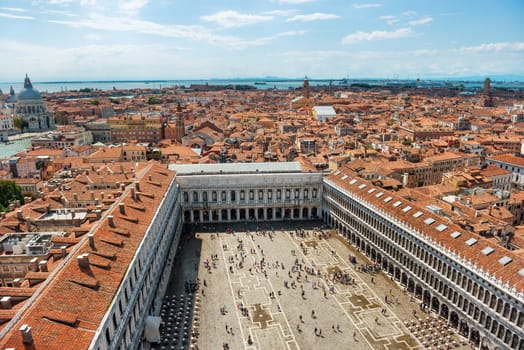 Air view to famous San Marco square in Venice, Italy. Piazza with many people