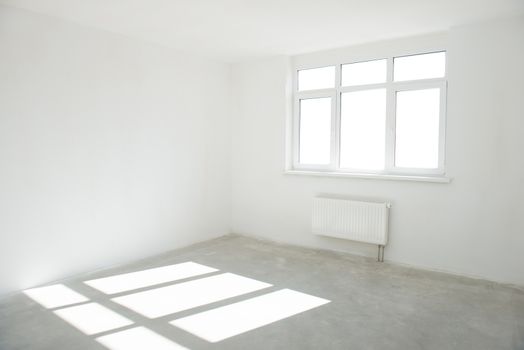 White room with window full of light