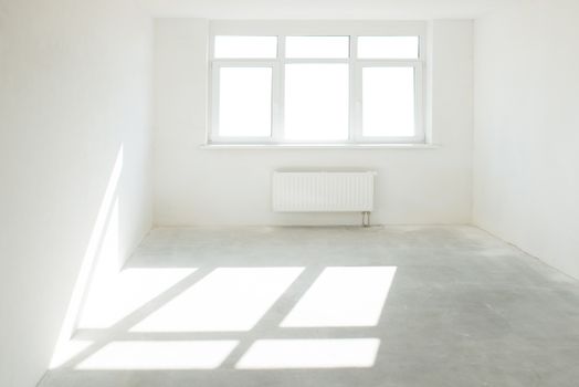 White room with window full of light