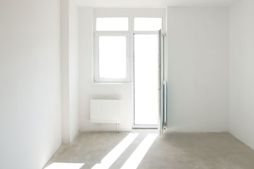 White room with window full of light