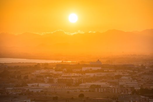 Sunset over european city. Cagliari, Sardinia, Italy.