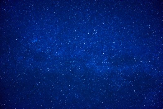 Blue dark night sky with many stars. Milky way on the space background