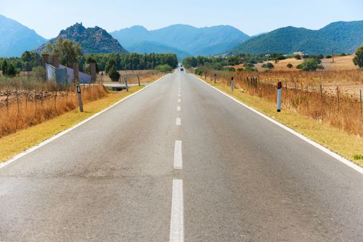 Highway road. Travel landscape with mountains on horizon