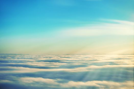 Amazing view from plane on the sky, sunset sun and clouds