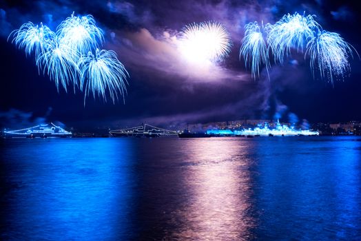 Blue colorful fireworks on the black sky background