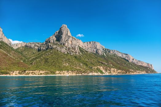 Coast and blue Mediterranean sea in Sardinia, Italy. View from the yaсht