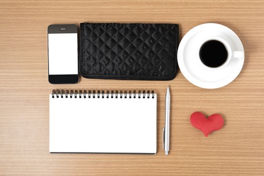 desktop : coffee with phone,notepad,wallet,heart on wood background