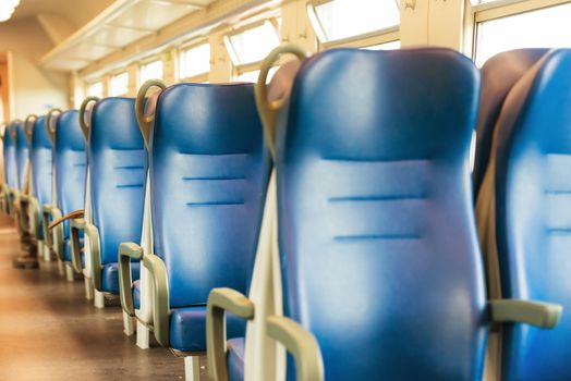 Empty blue seats in european modern train