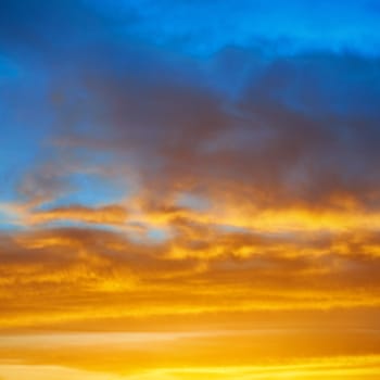 Dramatic sky at sunset with red, yellow, orange and blue colors