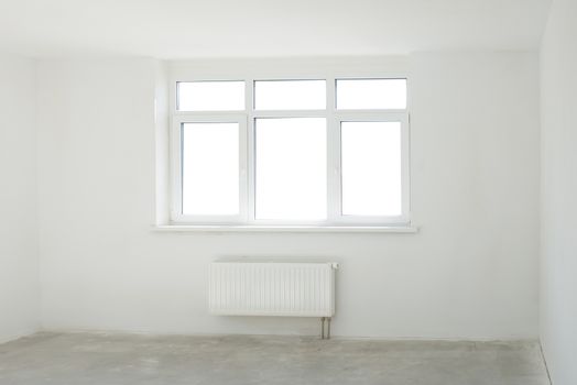 White room with window full of light