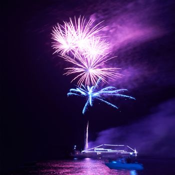 Blue colorful fireworks on the black sky background