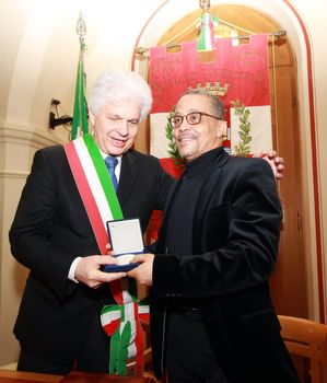 ITALY, Pordenone: Algerian writer Yasmina Khadra, whose real name is Mohammed Moulessehoul, poses in Pordenone before an official ceremony of the presentation of the seal during the Dedica Festival 2016 on 9 March, 2016