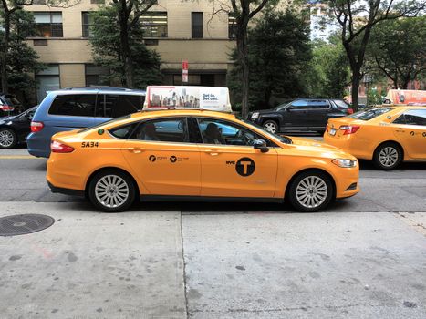 A yellow NYC taxi cab.