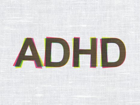 Healthcare concept: CMYK ADHD on linen fabric texture background