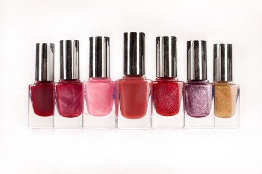 Bottles with enamel on isolated white background
