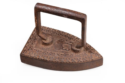 Old metal iron on isolated studio white background