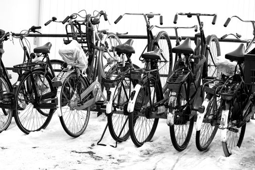 Bikes in winter snow in Amsterdam.