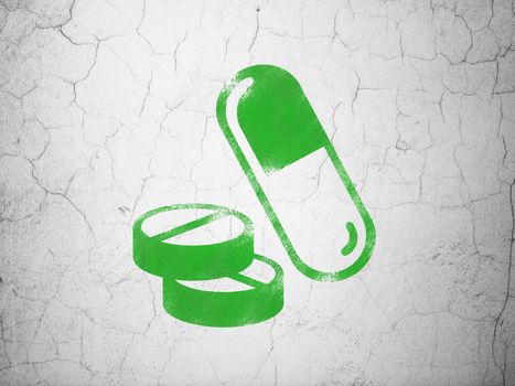 Health concept: Green Pills on textured concrete wall background