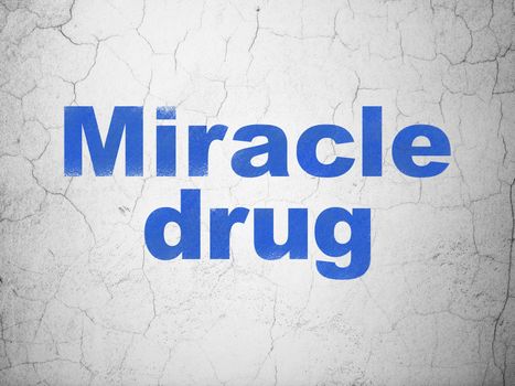 Health concept: Blue Miracle Drug on textured concrete wall background