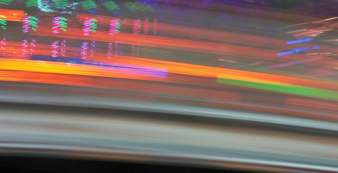 Night colors of the amusement park lights moving, light trails, slow shutter-speed