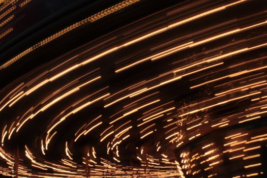 Night colors of the amusement park lights moving, light trails, slow shutter-speed