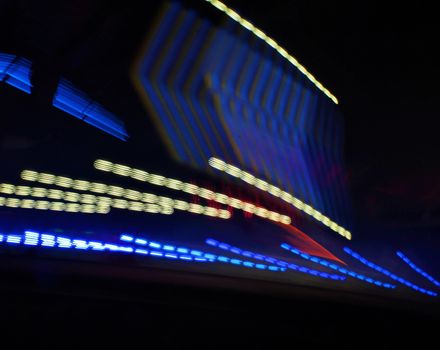 Night colors of the amusement park lights moving, light trails, slow shutter-speed