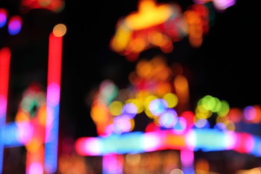 Night colors of the amusement park lights moving, light trails, slow shutter-speed