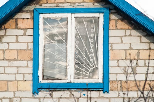 closed window in a brick old house