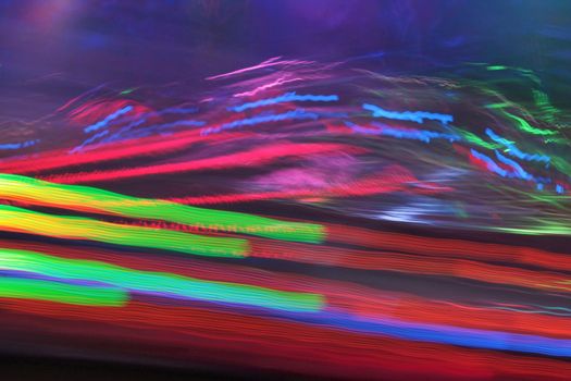 Night colors of the amusement park lights moving, light trails, slow shutter-speed