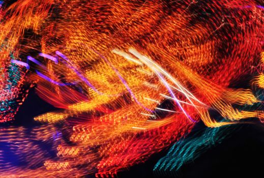 Night colors of the amusement park lights moving, light trails, slow shutter-speed