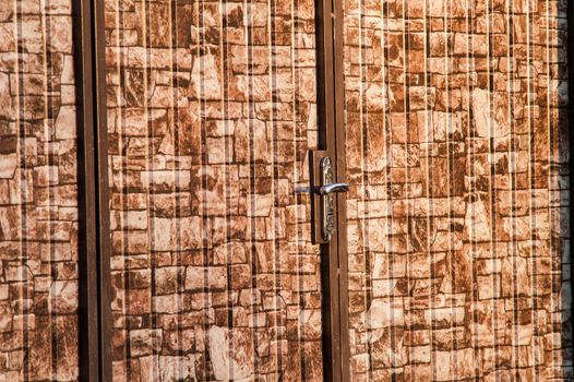 brown camouflage wicket door in the fence