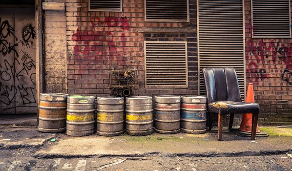 Grungy Urban Image Of Beer Barrels In An Alleyway Behind A Bar Or Pub