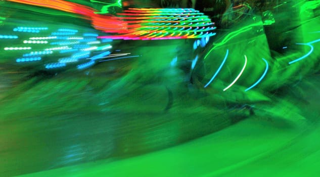 Night colors of the amusement park lights moving, light trails, slow shutter-speed