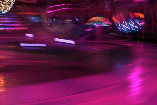 Night colors of the amusement park lights moving, light trails, slow shutter-speed