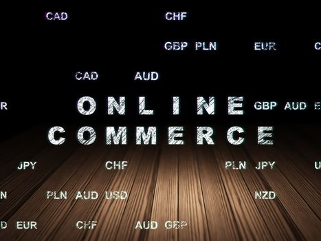 Business concept: Glowing text Online Commerce in grunge dark room with Wooden Floor, black background with Currency