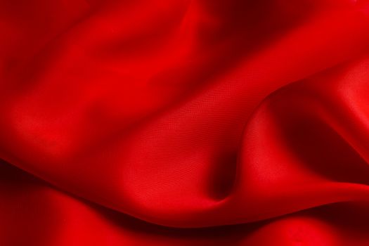 the texture of the red fabric from the delicate chiffon