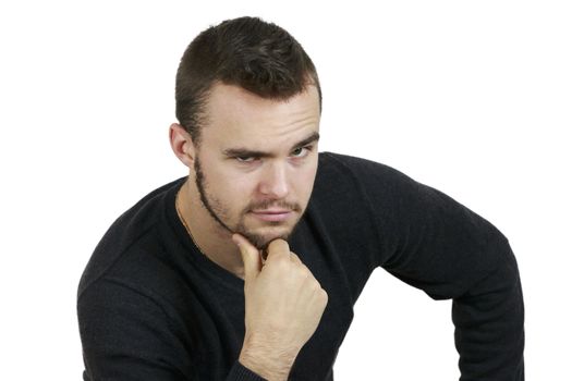 Young Man With Hand on Chin on White Background