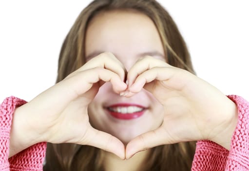 Pretty Young Girl Making a heart with Hands