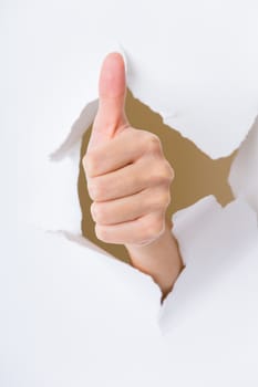 Human hand gesturing thumbs up