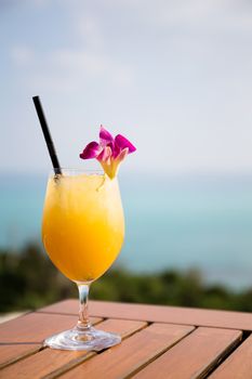 Pineapple juice at restaurant beside sea