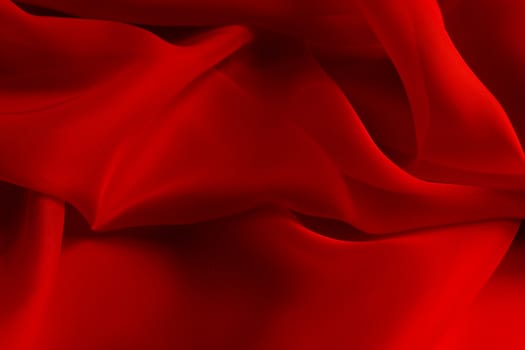 the texture of the red fabric from the delicate chiffon