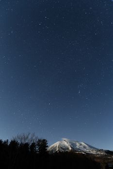 Starry night with snow mountain