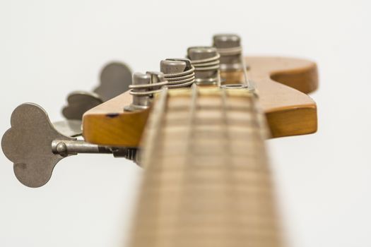 close up of the head of an electric four sting bass